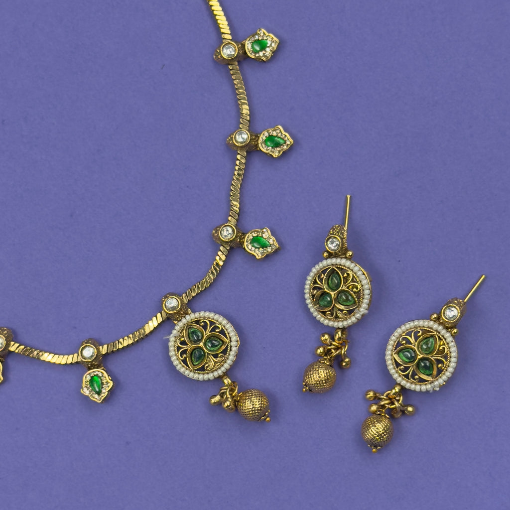 Mrinalini emerald green antique necklace set with matching earrings