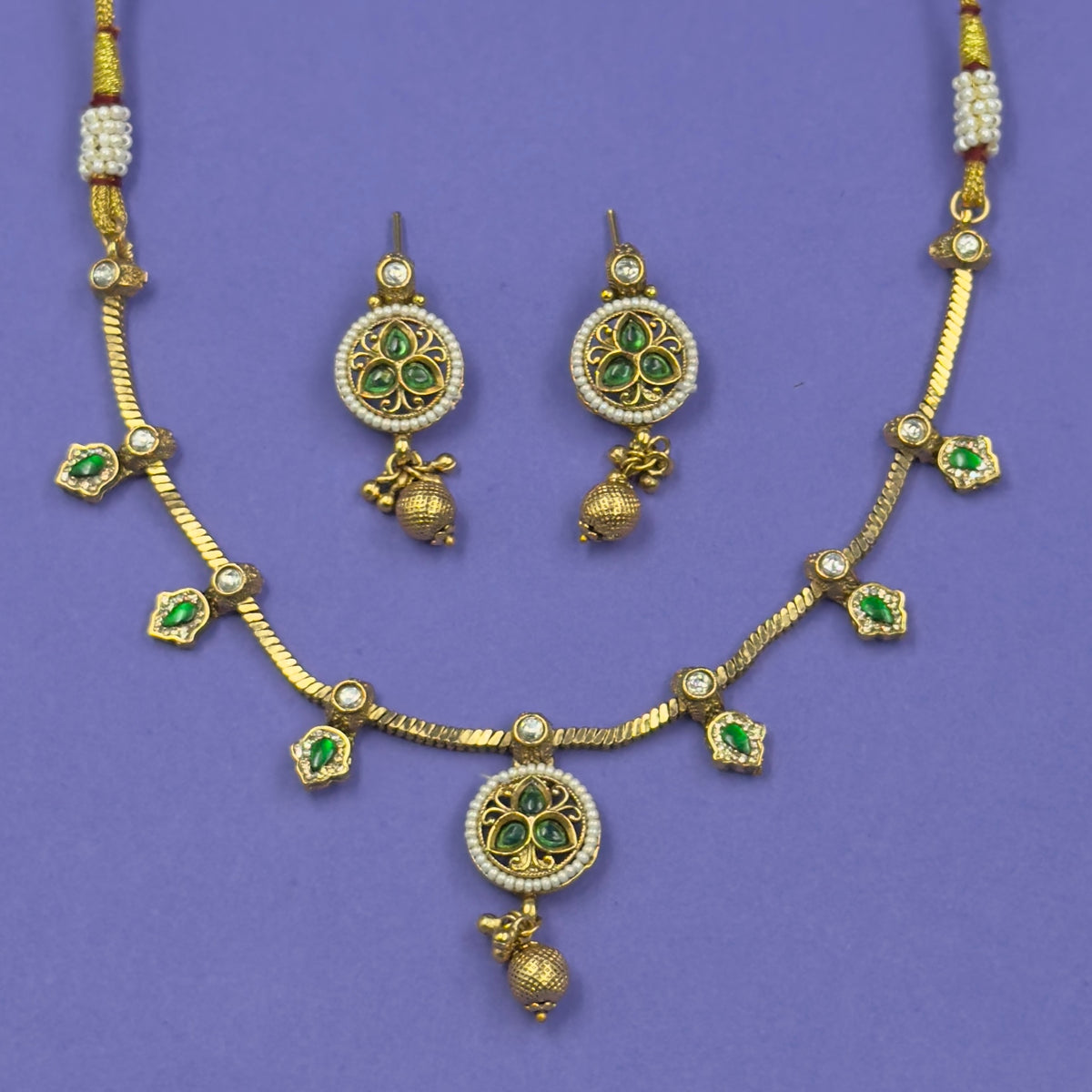 Mrinalini emerald green antique necklace set with matching earrings