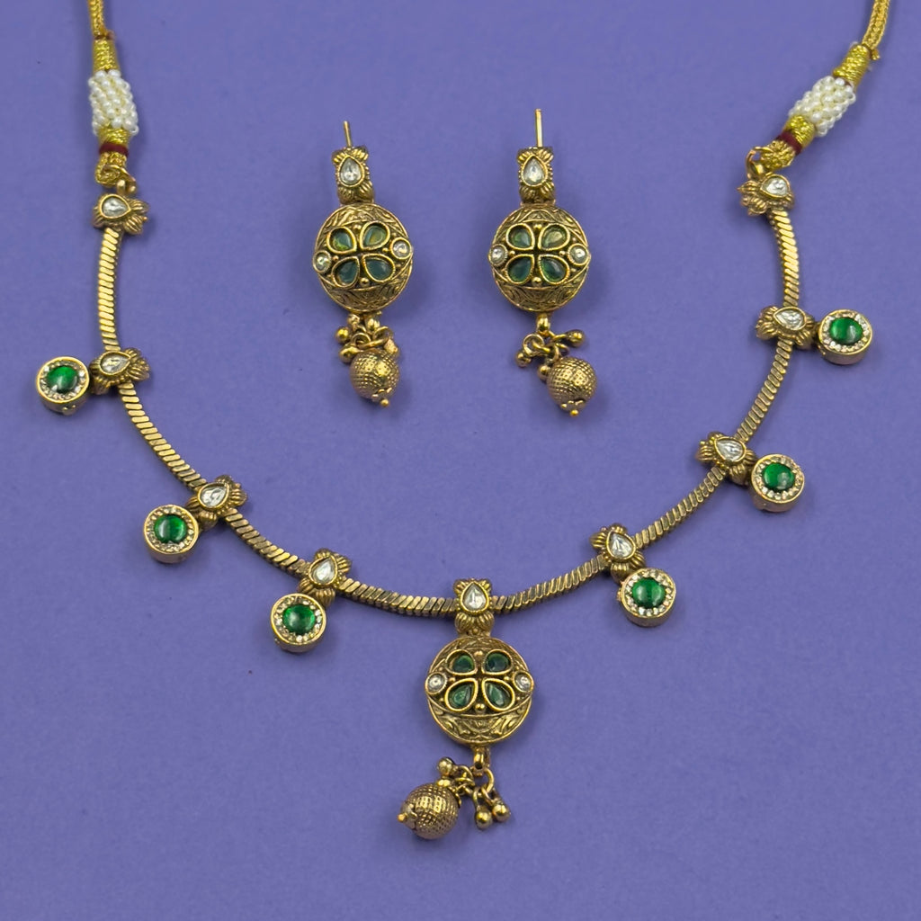 Jyotsna emerald green antique necklace set with matching earrings