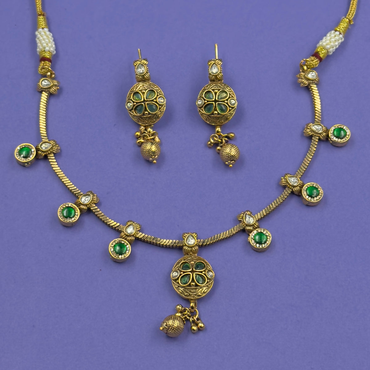 Jyotsna emerald green antique necklace set with matching earrings