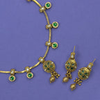 Jyotsna emerald green antique necklace set with matching earrings