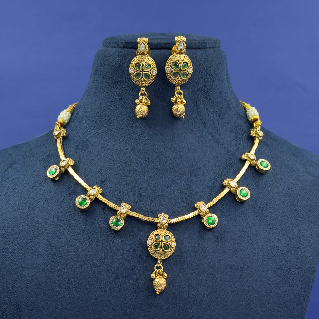 Jyotsna emerald green antique necklace set with matching earrings